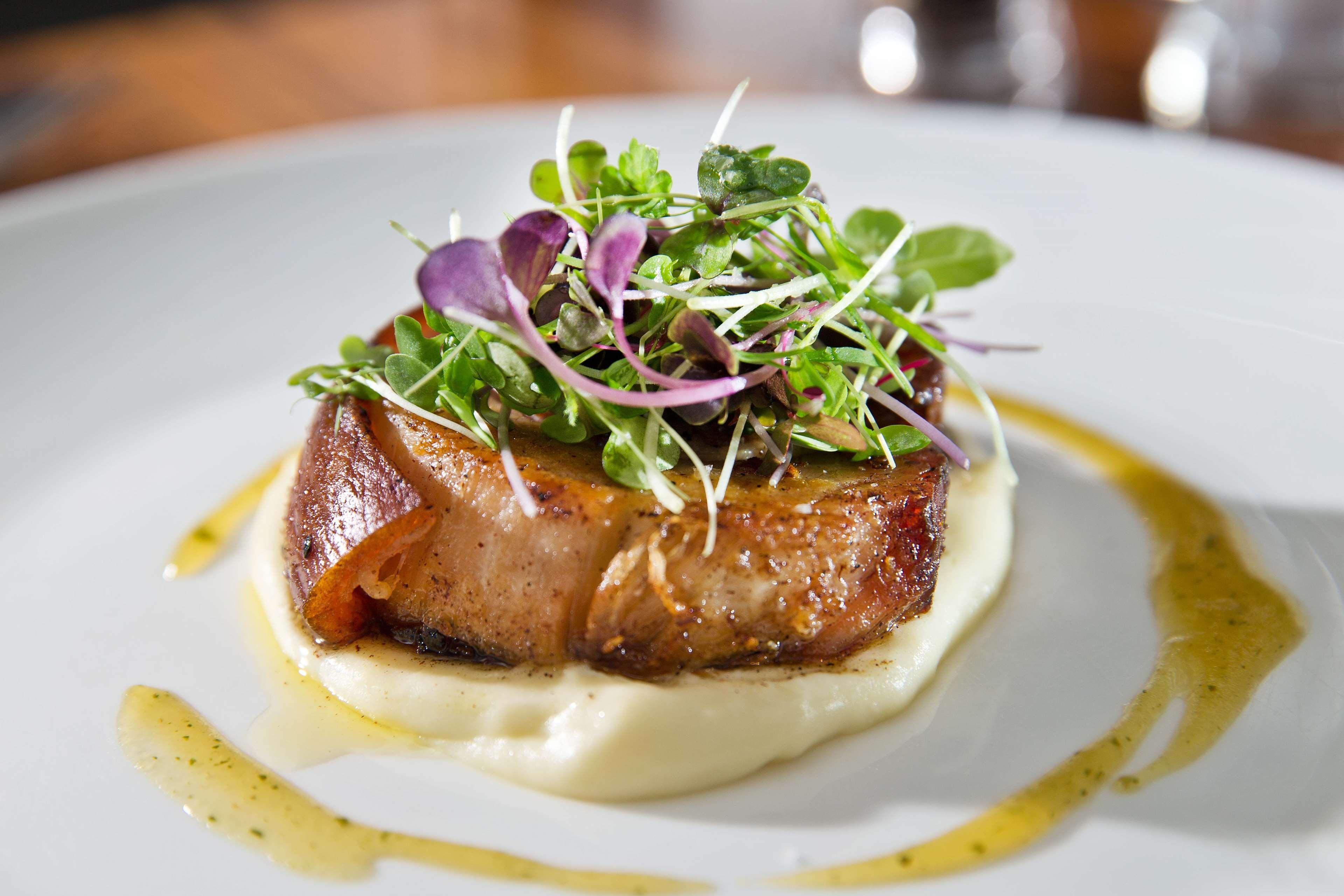Intercontinental Brisbane By Ihg Buitenkant foto A steak prepared with a garnish of microgreens